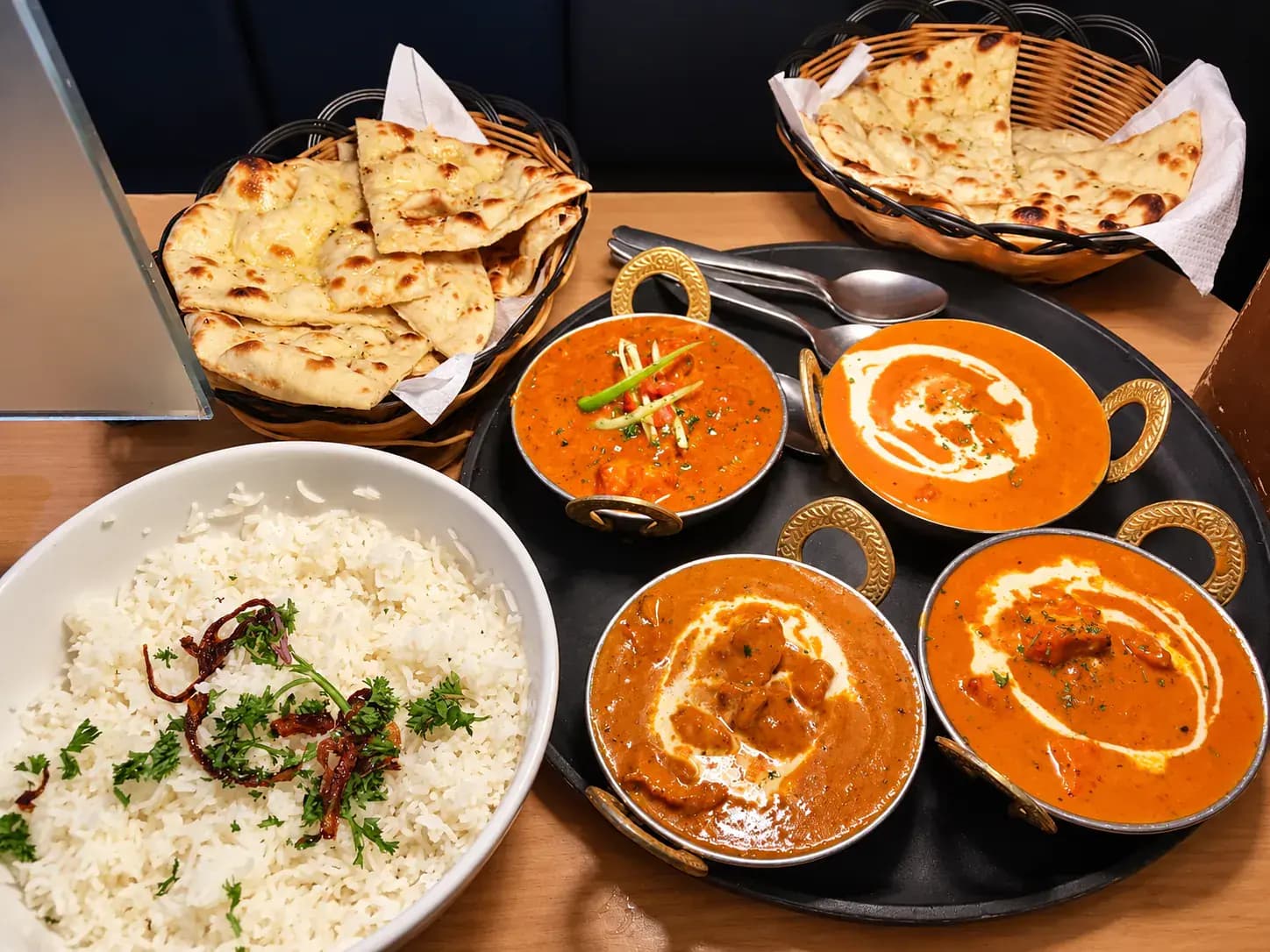 A generous Indian meal served in traditional dishes